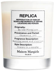 replica by the fireplace candle