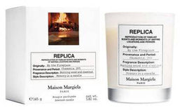 replica by the fireplace candle