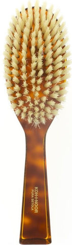 Oval brush with white bristle turtle handle